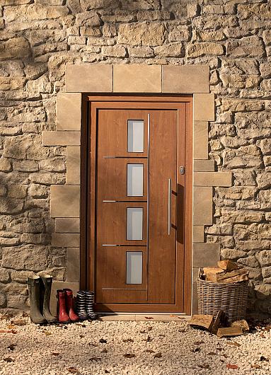 Wood-effect front door with four frosted glass panels and a vertical handle. Set in a rustic stone wall with boots and logs outside