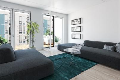Modern apartment living room with grey sofas and two sets of white Alitherm doors open to a balcony