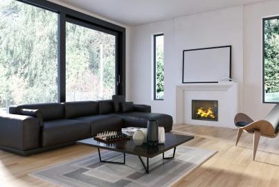 Living room with a black sofa, fireplace, and a large black Origin sliding door and tall Origin windows