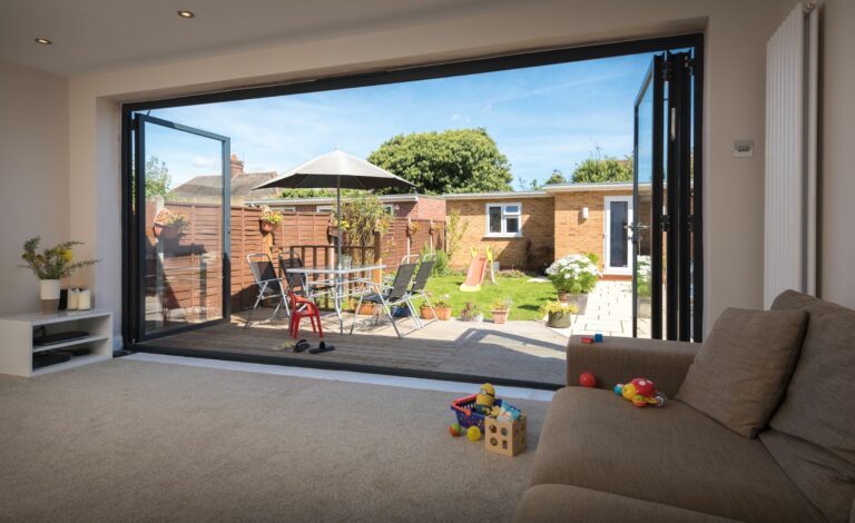 origin ob-49 open bifold doors looking out to a garden room